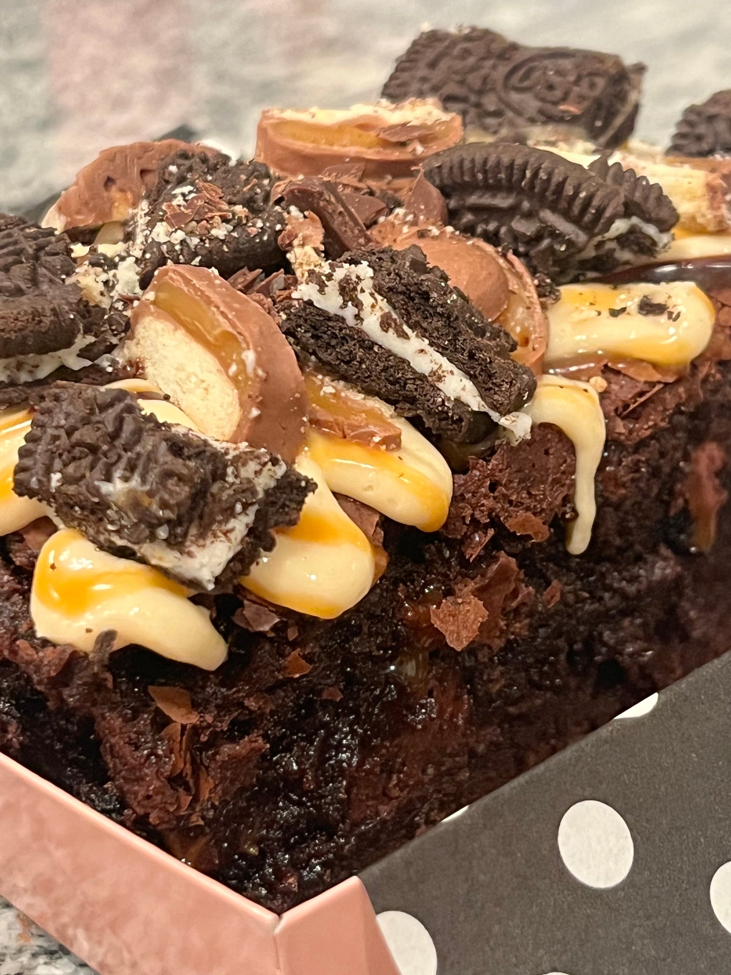 Boom Boom Brownie covered in salted caramel, Oreos and Twix candy.