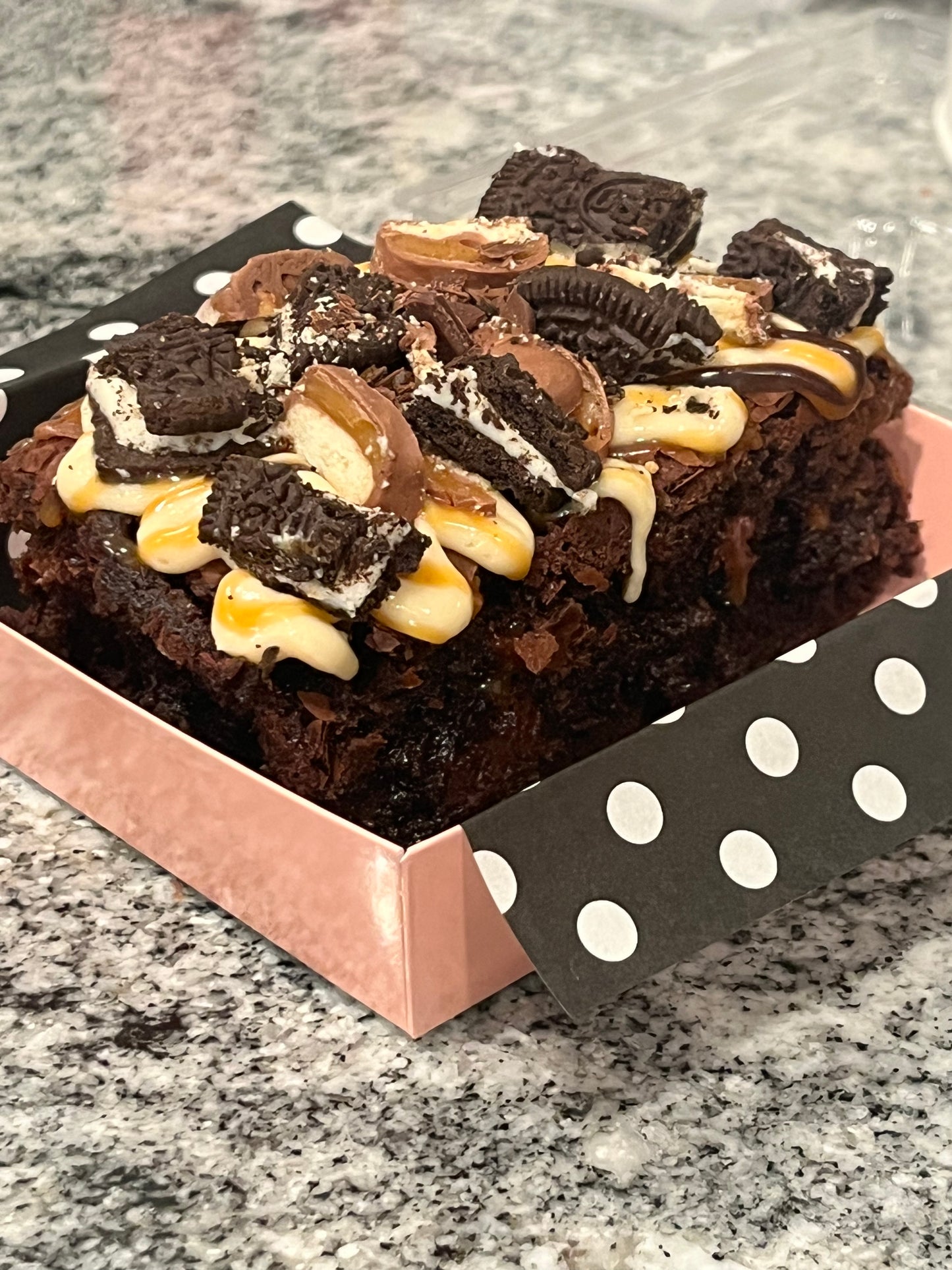 Boom Boom Brownie covered in salted caramel, Oreos and Twix candy.