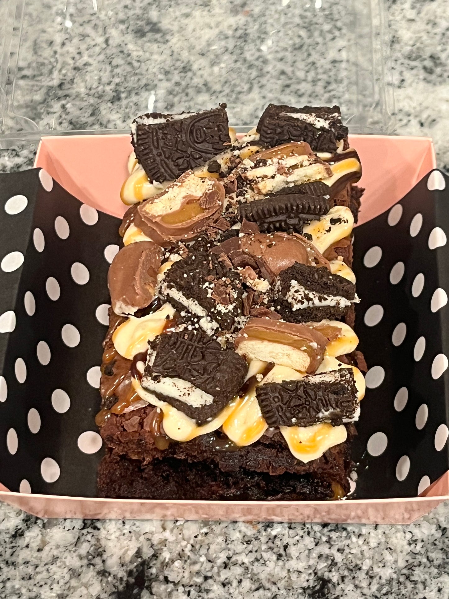 Boom Boom Brownie covered in salted caramel, Oreos and Twix candy.
