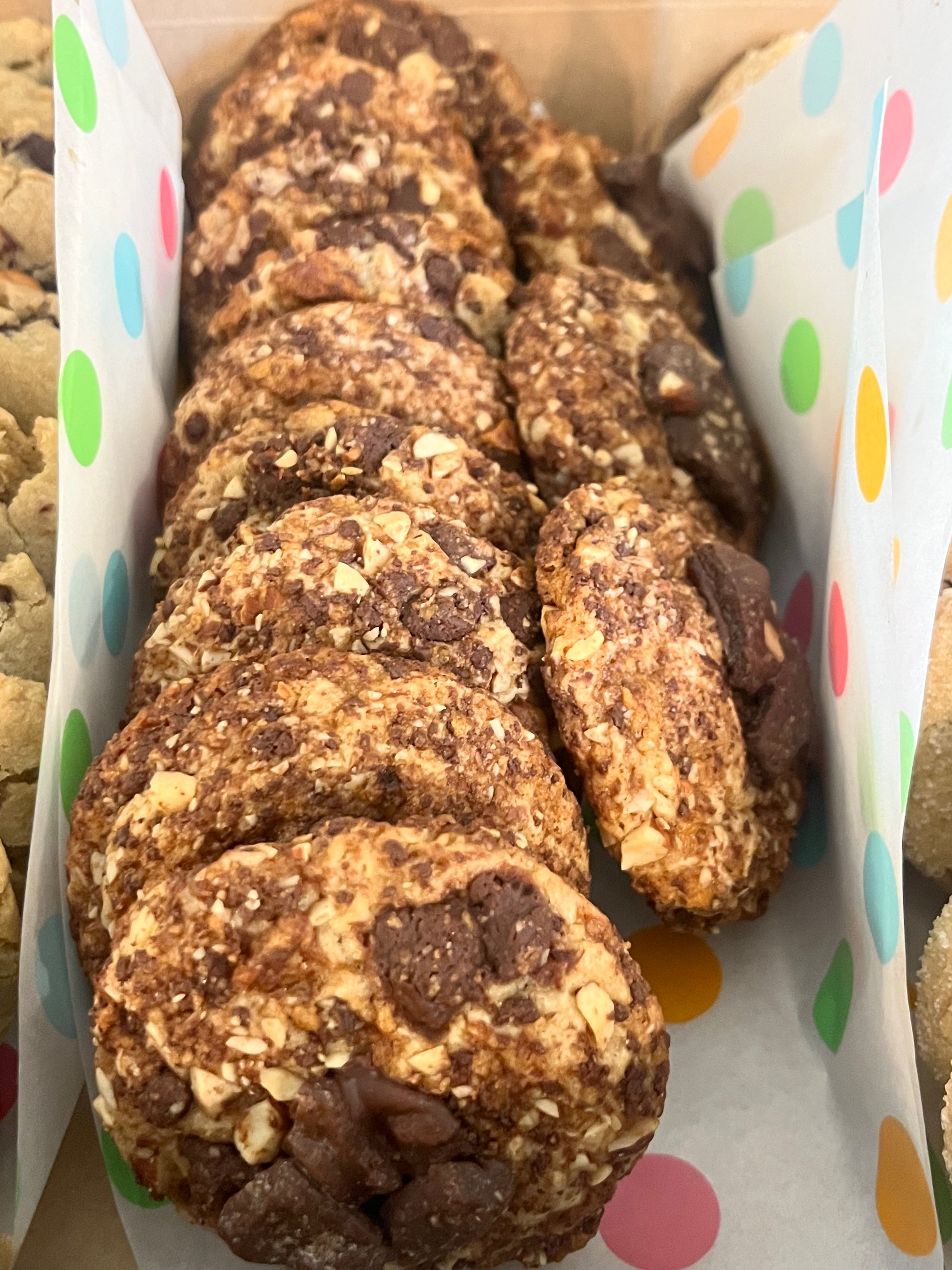 Get Ur Toffee On cookies lined up in a bakery box.