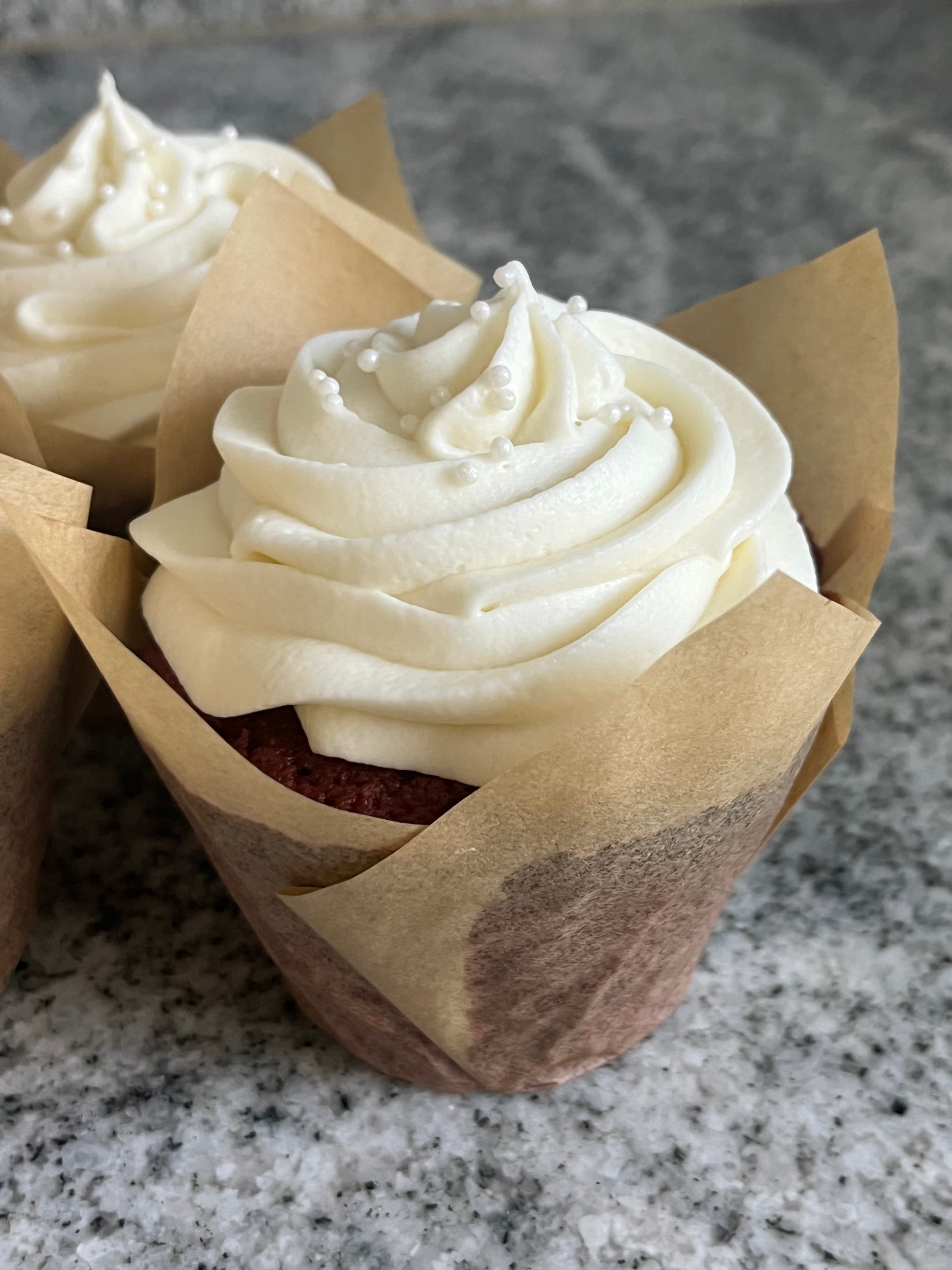 Image of two Love At First Bite cupcakes, fully wrapped.