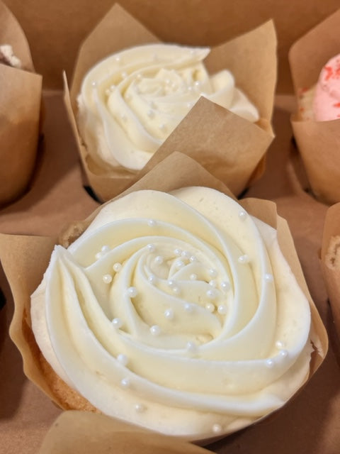 Very Vanilla cupcakes in a pastry box ready to be picked up.